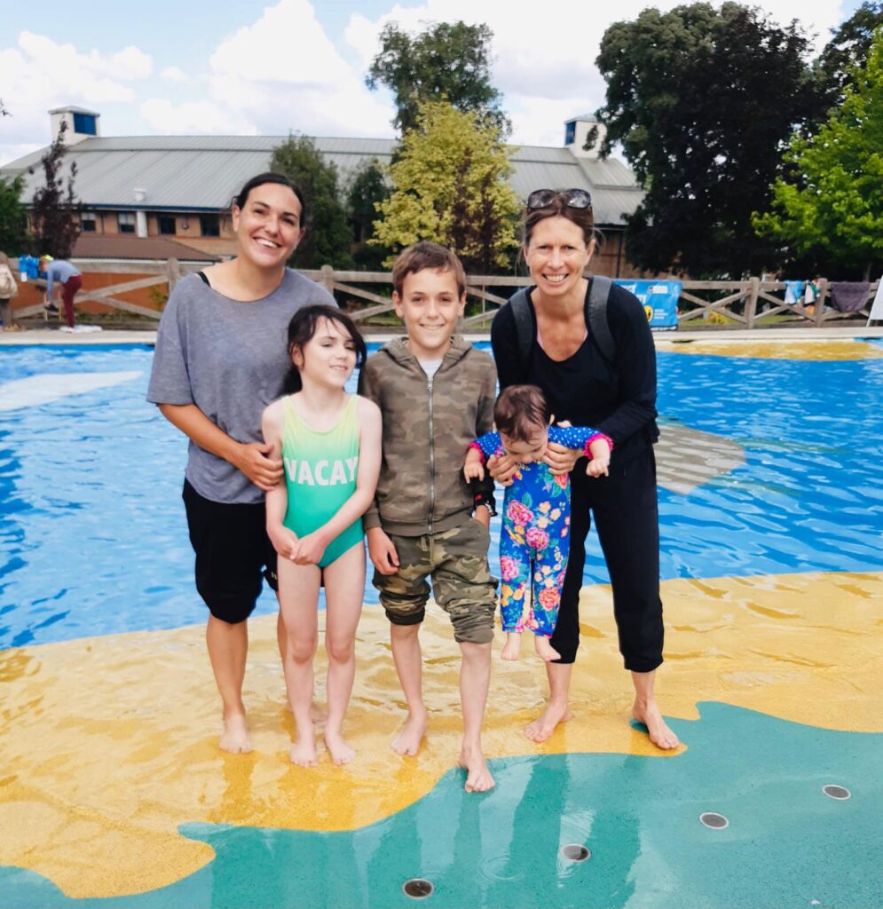 Family with a volunteer at a water park